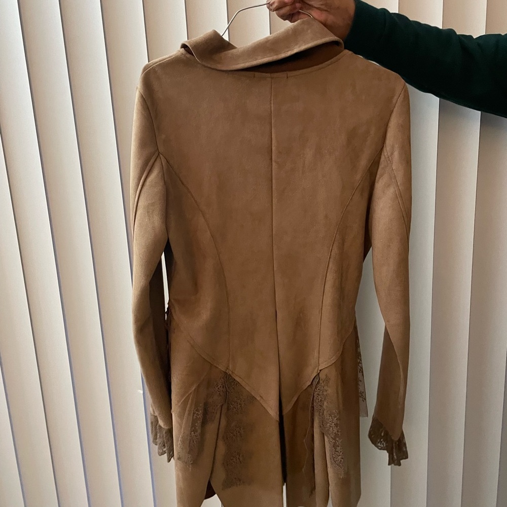 Good condition, never worn. Tan suede jacket.